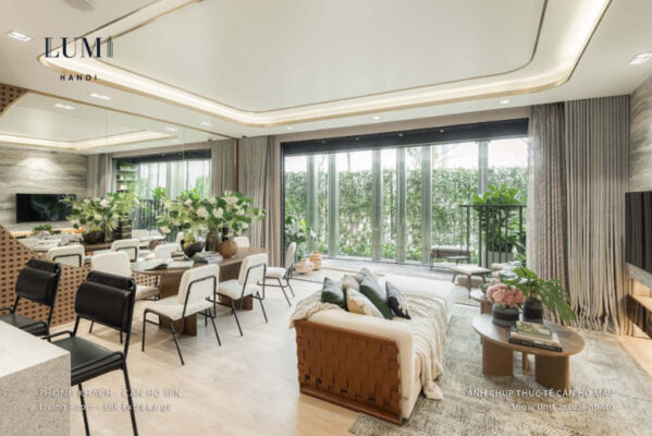 Sophisticated, comfortable 3-bedroom apartment with connected living room and dining room, harmoniously combining natural light and soft light from the artificial ceiling light system.
